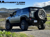 2024-gmc-hummer-ev-suv-3x-edition-1-moonshot-green-matte-g7w-first-drive-exterior-030-side-rear-three-quarters-rear-wheel-steer-extract-mode