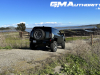 2024-gmc-hummer-ev-suv-3x-edition-1-moonshot-green-matte-g7w-first-drive-exterior-033-side-rear-three-quarters-spare-tire-rear-wheel-steer-extract-mode