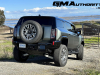 2024-gmc-hummer-ev-suv-3x-edition-1-moonshot-green-matte-g7w-first-drive-exterior-034-side-rear-three-quarters-spare-tire-rear-wheel-steer-extract-mode