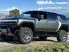 2024-gmc-hummer-ev-suv-3x-edition-1-moonshot-green-matte-g7w-first-drive-exterior-038-side-front-three-quarters-extract-mode
