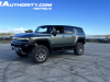 2024-gmc-hummer-ev-suv-3x-edition-1-moonshot-green-matte-g7w-first-drive-exterior-048-side-front-three-quarters-extract-mode
