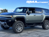 2024-gmc-hummer-ev-suv-3x-edition-1-moonshot-green-matte-g7w-first-drive-exterior-049-side-front-three-quarters-extract-mode