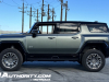 2024-gmc-hummer-ev-suv-3x-edition-1-moonshot-green-matte-g7w-first-drive-exterior-051-side-22-inch-wheels-phz-extract-mode