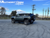2024-gmc-hummer-ev-suv-3x-edition-1-moonshot-green-matte-g7w-first-drive-exterior-052-side-rear-three-quarters-extract-mode