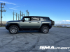 2024-gmc-hummer-ev-suv-3x-edition-1-moonshot-green-matte-g7w-first-drive-exterior-066-side-low-ride-height