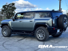 2024-gmc-hummer-ev-suv-3x-edition-1-moonshot-green-matte-g7w-first-drive-exterior-069-side-rear-three-quarters-low-ride-height