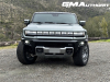 2024-gmc-hummer-ev-suv-3x-edition-1-moonshot-green-matte-g7w-first-drive-exterior-092-front-fascia-wheels-turned