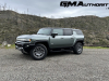 2024-gmc-hummer-ev-suv-3x-edition-1-moonshot-green-matte-g7w-first-drive-exterior-095-side-front-three-quarters