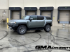 2024-gmc-hummer-ev-suv-3x-edition-1-moonshot-green-matte-g7w-first-drive-exterior-169-side-front-three-quarters