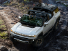 2024-gmc-hummer-ev-suv-exterior-036-overhead-front-three-quarters-offroading-roof-panels-off