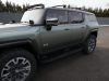 2024-gmc-hummer-ev-suv-exterior-088-moonshot-green-matte-edition-1-side-with-roof-rack-front-accessory-lights