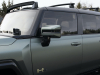 2024-gmc-hummer-ev-suv-exterior-090-moonshot-green-matte-edition-1-side-with-roof-rack-front-accessory-lights
