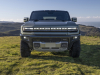 2024-gmc-hummer-ev-suv-extreme-off-road-package-z6x-moonshot-green-matte-g7w-press-photos-exterior-001-front