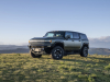 2024-gmc-hummer-ev-suv-extreme-off-road-package-z6x-moonshot-green-matte-g7w-press-photos-exterior-004-front-three-quarters