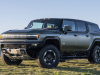 2024-gmc-hummer-ev-suv-extreme-off-road-package-z6x-moonshot-green-matte-g7w-press-photos-exterior-005-front-three-quarters