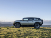2024-gmc-hummer-ev-suv-extreme-off-road-package-z6x-moonshot-green-matte-g7w-press-photos-exterior-006-side