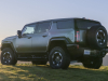 2024-gmc-hummer-ev-suv-extreme-off-road-package-z6x-moonshot-green-matte-g7w-press-photos-exterior-011-side-rear-three-quarters