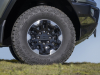 2024-gmc-hummer-ev-suv-extreme-off-road-package-z6x-moonshot-green-matte-g7w-press-photos-exterior-017-goodyear-wrangler-territory-mt-tire-18-inch-black-aluminum-with-machined-accents-rcs