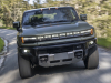 2024-gmc-hummer-ev-suv-extreme-off-road-package-z6x-moonshot-green-matte-g7w-press-photos-exterior-020-front