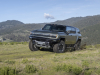 2024-gmc-hummer-ev-suv-extreme-off-road-package-z6x-moonshot-green-matte-g7w-press-photos-exterior-021-front-three-quarters