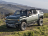 2024-gmc-hummer-ev-suv-extreme-off-road-package-z6x-moonshot-green-matte-g7w-press-photos-exterior-024-side-front-three-quarters-infinity-roof-panels-removed