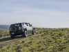 2024-gmc-hummer-ev-suv-extreme-off-road-package-z6x-moonshot-green-matte-g7w-press-photos-exterior-026-rear-three-quarters-infinity-roof-panels-removed