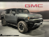 2024-gmc-hummer-ev-suv-extreme-offroad-package-media-briefing-moonshot-green-matte-g7w-exterior-002-side-front-three-quarters