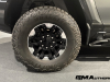 2024-gmc-hummer-ev-suv-extreme-offroad-package-media-briefing-moonshot-green-matte-g7w-exterior-008-goodyear-wrangler-territory-mt-tire-18-inch-wheel-black-aluminum-wheel-with-machined-accents-rcs