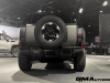 2024-gmc-hummer-ev-suv-extreme-offroad-package-media-briefing-moonshot-green-matte-g7w-exterior-009-rear-tail-lights-spare-tire