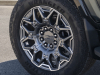 2024-gmc-hummer-ev-suv-moonshot-green-matte-g7w-press-photos-exterior-016-goodyear-wrangler-territory-at-tire-22-inch-premium-finish-painted-aluminum-wheel-with-selective-machining-phz