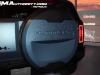 2024-gmc-hummer-ev-suv-omega-edition-neptune-blue-matte-media-reveal-exterior-021-spare-tire-cover-with-hummer-ev-logo-debossed-and-moon-topography