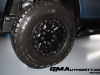 2024-gmc-hummer-ev-suv-omega-edition-neptune-blue-matte-media-reveal-exterior-024-goodyear-wrangler-territory-mt-mud-terrain-tire-gloss-black-18-inch-wheel-syw