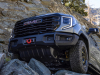 2023-sierra-1500-at4x-aev-edition-press-photos-exterior-005-front-aev-front-bumper-with-winch-grille-front-approach-skid-plate-wheels-33-inch-tires