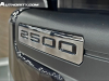 2024-gmc-sierra-2500-hd-denali-ultimate-titanium-rush-metallic-g6m-reveal-photos-exterior-017-2500-badge-on-front-bumper