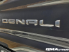 2024-gmc-sierra-2500-hd-denali-ultimate-titanium-rush-metallic-g6m-reveal-photos-exterior-027-denali-logo-badge-on-tailgate