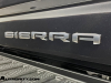 2024-gmc-sierra-2500-hd-denali-ultimate-titanium-rush-metallic-g6m-reveal-photos-exterior-028-sierra-logo-badge-on-tailgate