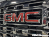 2024-gmc-sierra-3500-hd-denali-dual-rear-wheel-dually-onyx-black-gba-reveal-photos-exterior-015-grille-gmc-logo-badge-front-camera