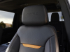 2024-gmc-sierra-hd-at4-press-photos-interior-006-driver-seat-detail-at4-script-on-headrest