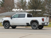 2024-gmc-sierra-hd-at4-summit-white-gaz-20-inch-10-spoke-machined-aluminum-wheels-with-grazen-metallic-painted-accents-q86-on-the-road-photos-exterior-007