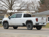 2024-gmc-sierra-hd-at4-summit-white-gaz-20-inch-10-spoke-machined-aluminum-wheels-with-grazen-metallic-painted-accents-q86-on-the-road-photos-exterior-008