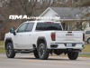 2024-gmc-sierra-hd-at4-summit-white-gaz-20-inch-10-spoke-machined-aluminum-wheels-with-grazen-metallic-painted-accents-q86-on-the-road-photos-exterior-009