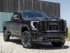 2024-gmc-sierra-hd-denali-ultimate-press-photos-exterior-003-front-three-quarters-drl-daytime-running-lights-vader-chrome-grille