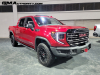 2023-gmc-sierra-at4x-1500-volcanic-red-tintcoat-gnt-2022-naias-detroit-live-photos-exterior-002-front-three-quarters