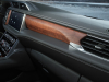 2023-gmc-yukon-denali-ultimate-press-photos-interior-010-paldao-wood-trim-in-front-of-front-passenger-mt-denali-coordinates-and-topographical-elements