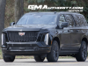 2025-cadillac-escalade-esv-sport-black-raven-gba-prototype-spy-shots-undisguised-april-2024-exterior-003-side-front-three-quarters-grille-headlights