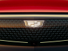2024-cadillac-lyriq-sport-600e4-radiant-red-tintcoat-gnt-press-photos-exterior-004-front-cadillac-logo-badge-on-illuminated-grille