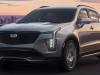 2024-cadillac-xt4-press-photos-exterior-006-front-three-quarters-drl-daytime-running-lights-grille-headlights