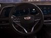 2024-cadillac-xt4-press-photos-interior-003-cockpit-33-inch-curved-gauge-cluster-and-infotainment-screen-display-cadillac-logo-on-steering-wheel