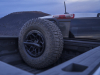2024-chevrolet-colorado-zr2-bison-press-photos-exterior-024-bed-mounted-spare-35-inch-goodyear-wrangler-territory-mt-mud-terrain-tire-17-inch-black-aev-beadlock-wheel