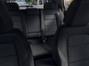 2024-chevrolet-equinox-ev-1lt-press-photo-interior-002-cloth-rear-seats-fold-down-center-rear-armrest-seat-belt-rear-window